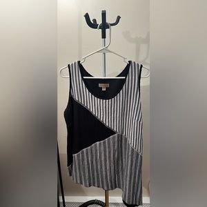 Super cute black and white tank top with uneven bottom hem. Never been worn